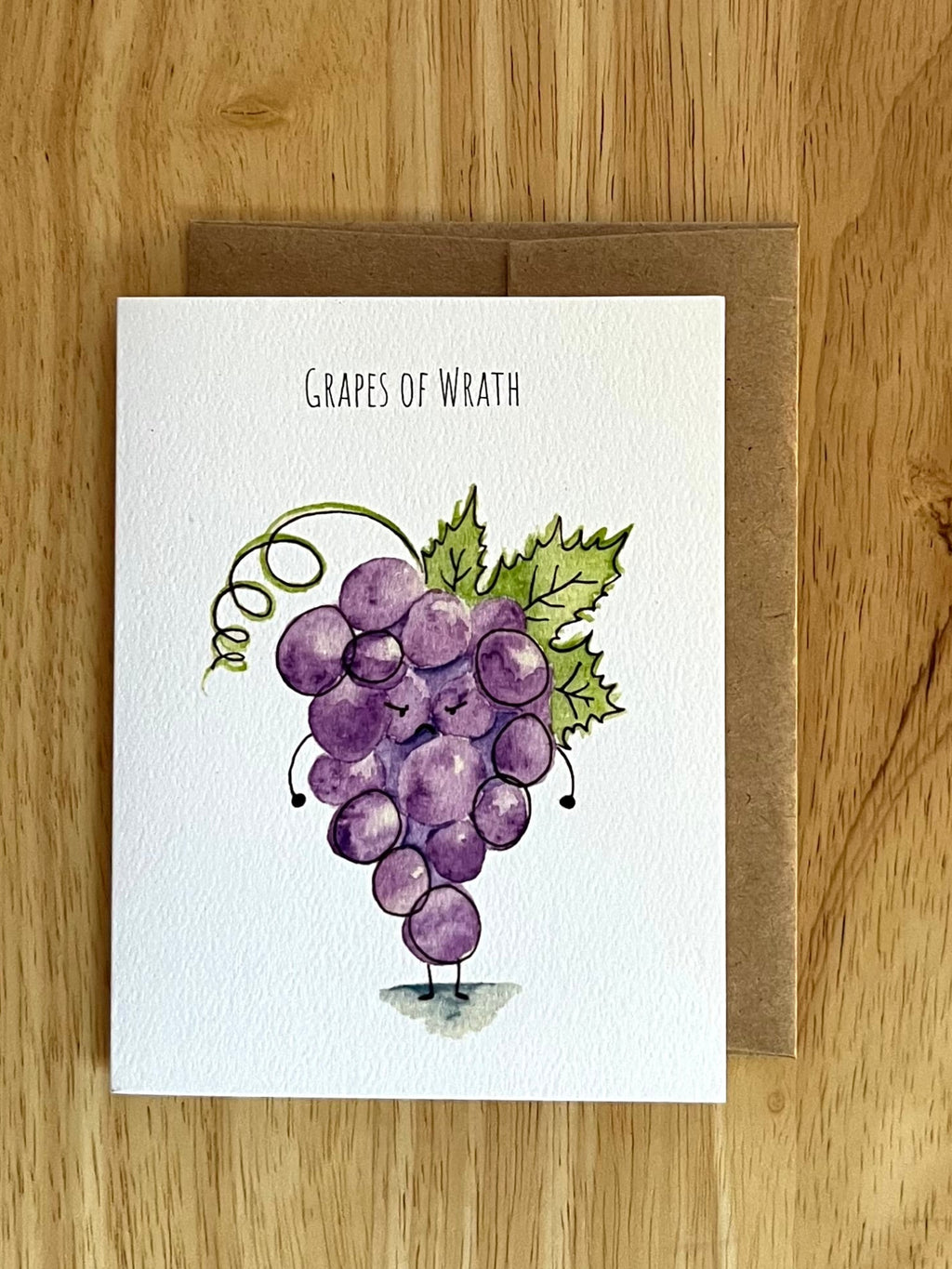 Minimalist 'Grapes of Wrath' literary pun card. Features moody watercolor grapes. A witty greeting card for book lovers and fans of classic literature.