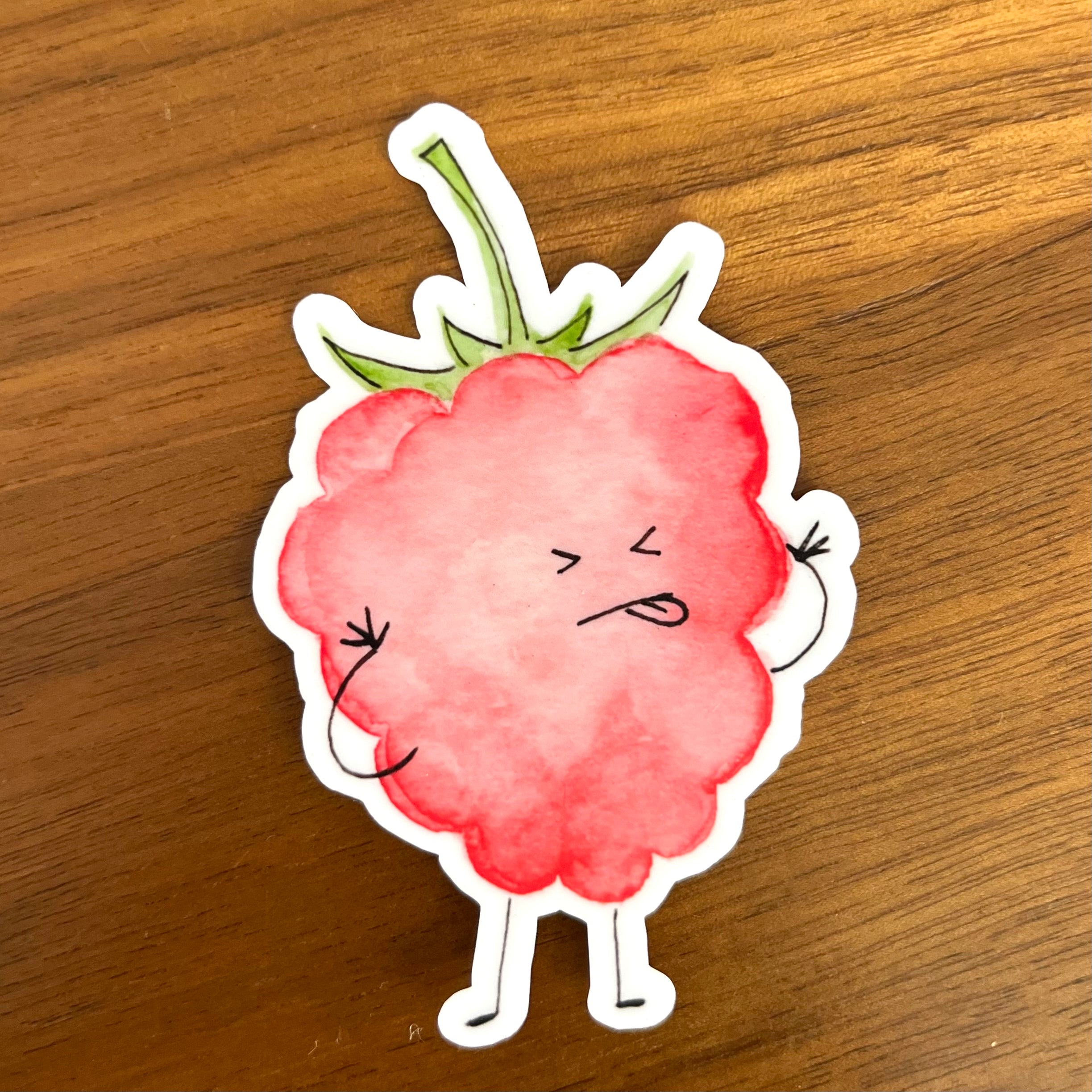 Die-cut vinyl sticker of raspberry blowing a raspberry