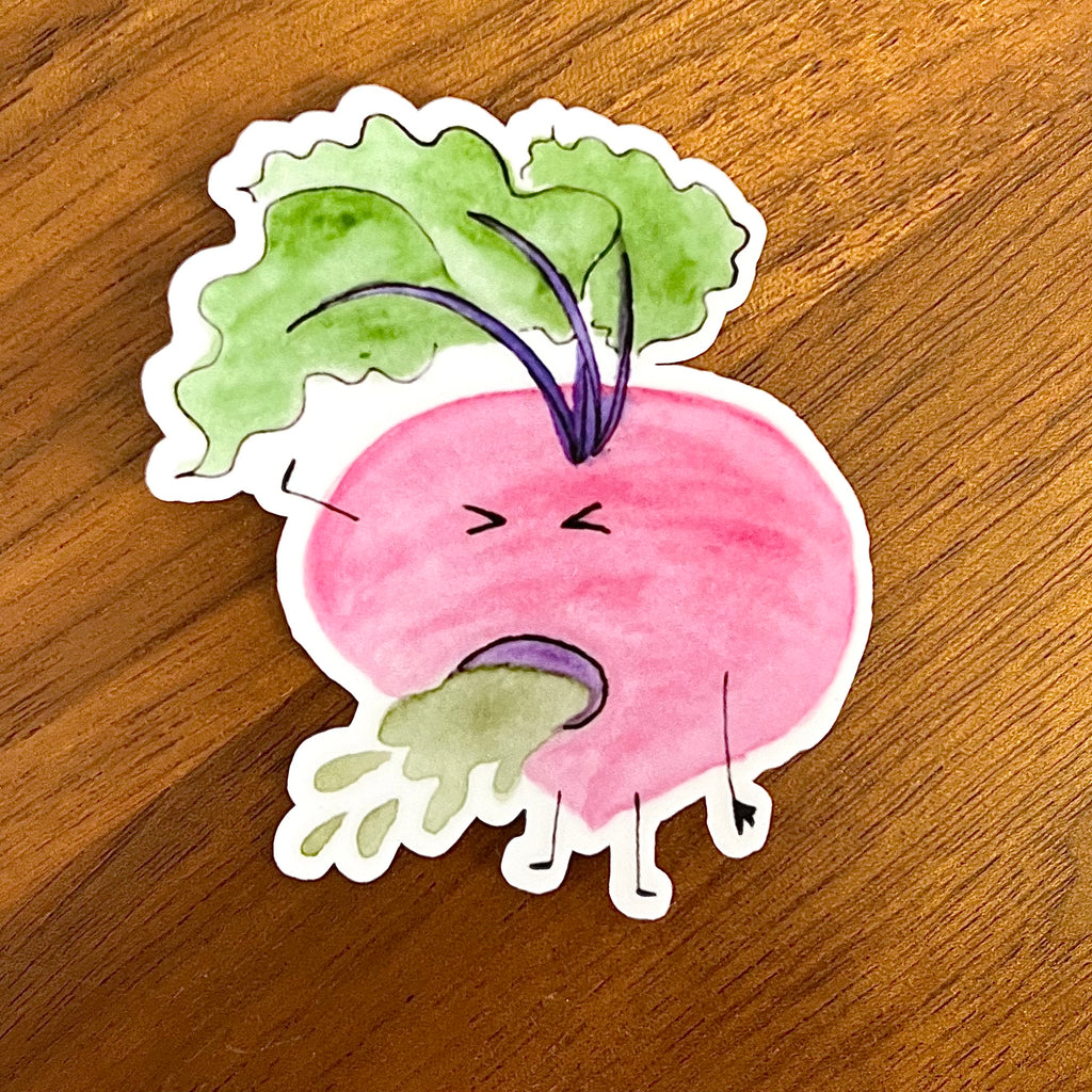 A die-cut sticker featuring a cartoon radish with a pink body, green leafy top, and a distressed, grumpy face, placed on a wooden surface.