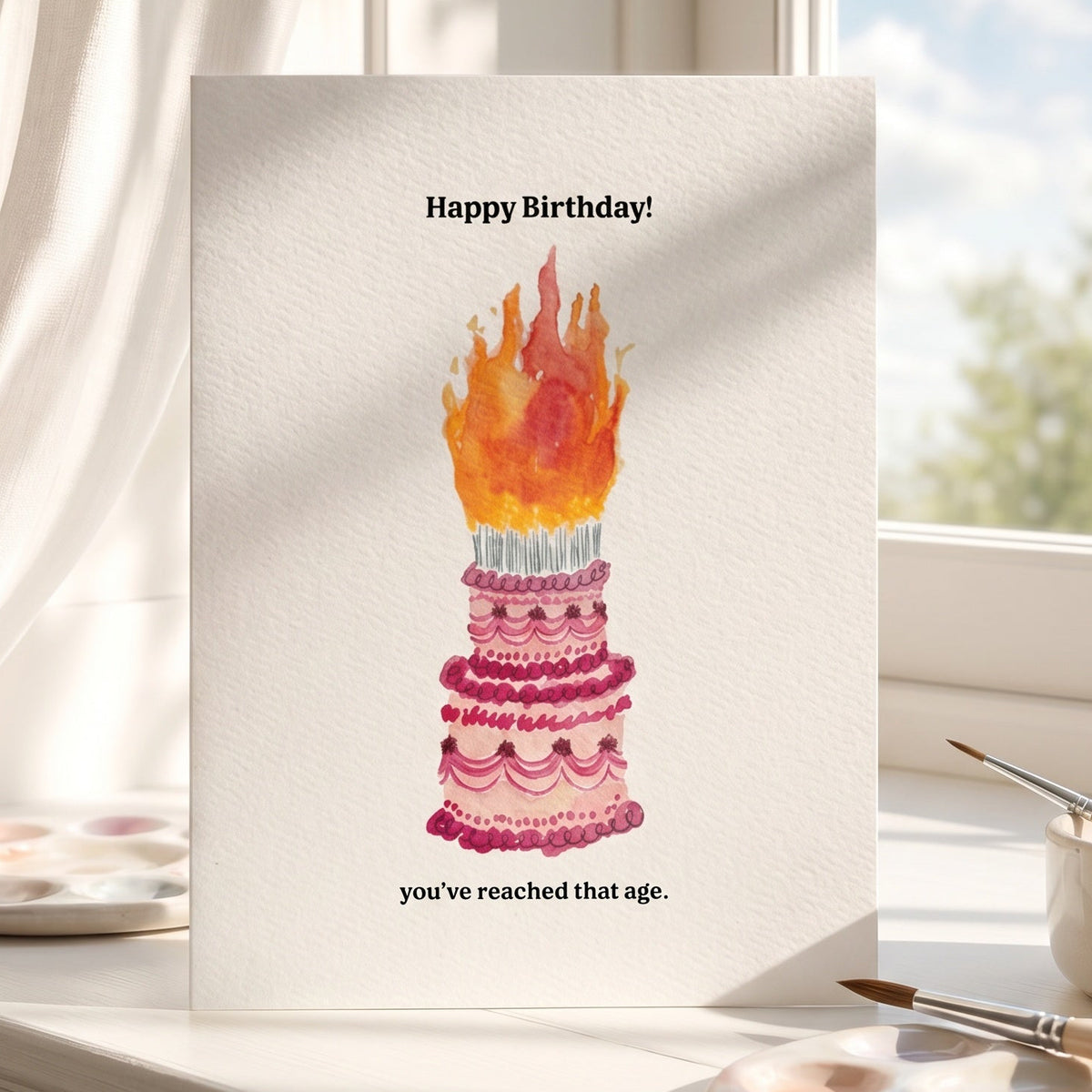 Birthday card with cake illustration on a windowsill with a view of trees