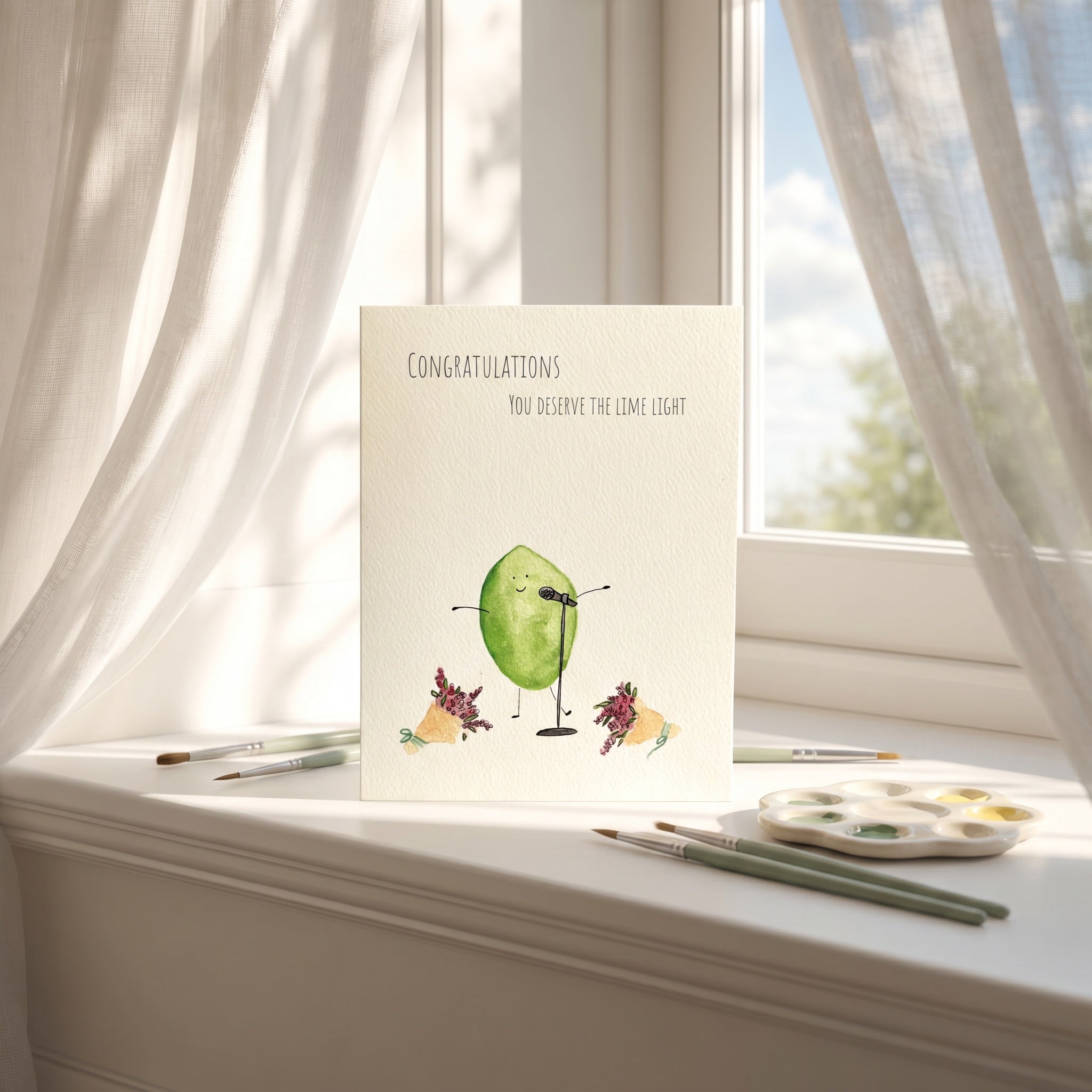 Greeting card with lime illustration on a windowsill with art supplies