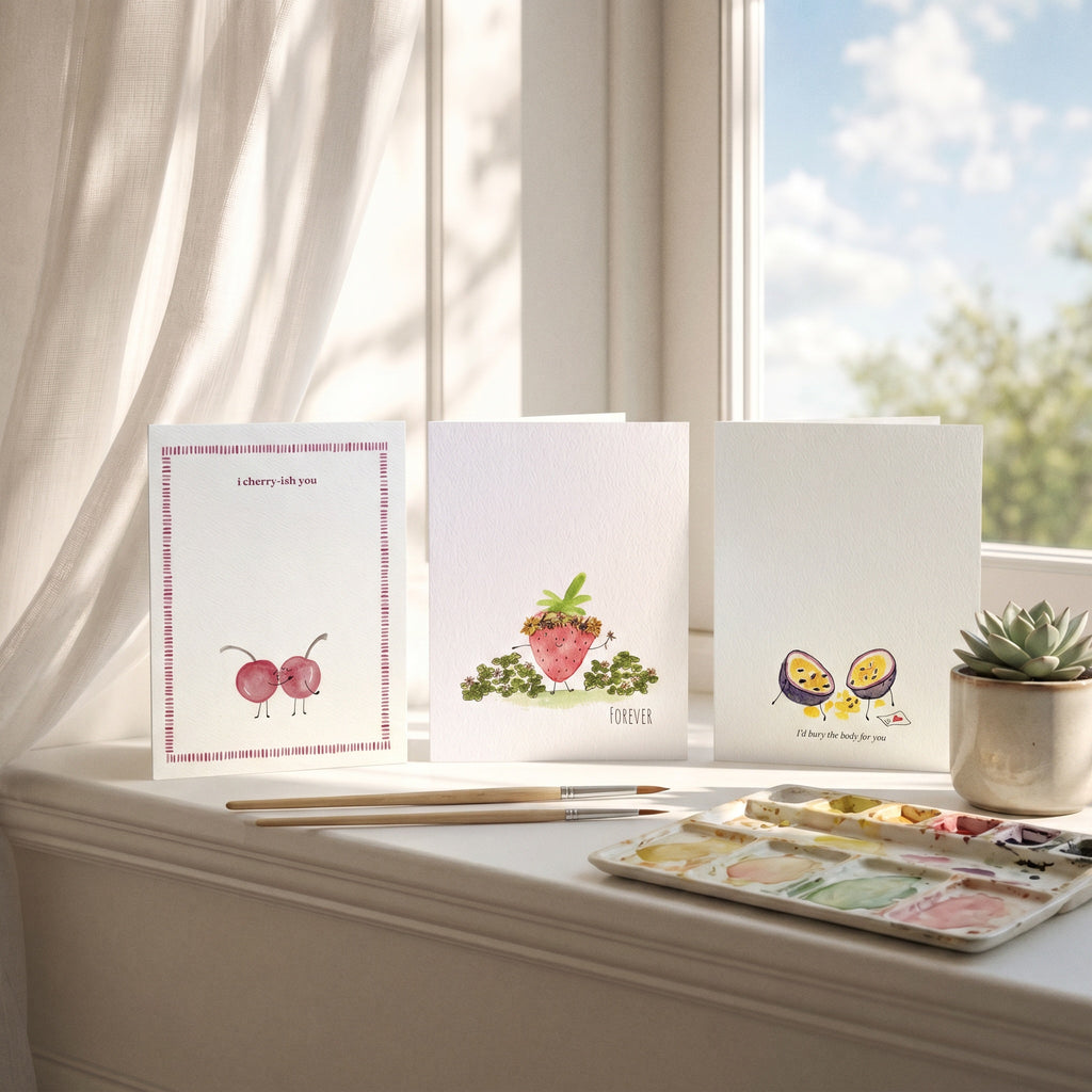 Three greeting cards on a windowsill with a watercolor set and plant. romantic anniversary and valentines