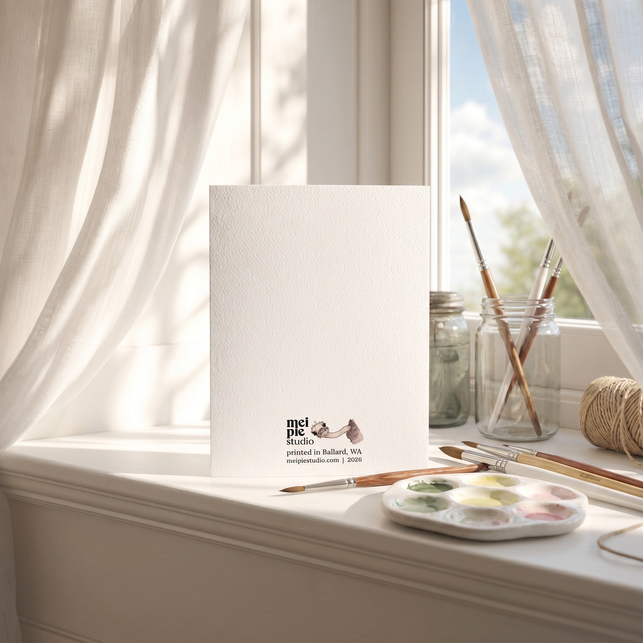 Canvas on a windowsill with art supplies and a visible brand logo.