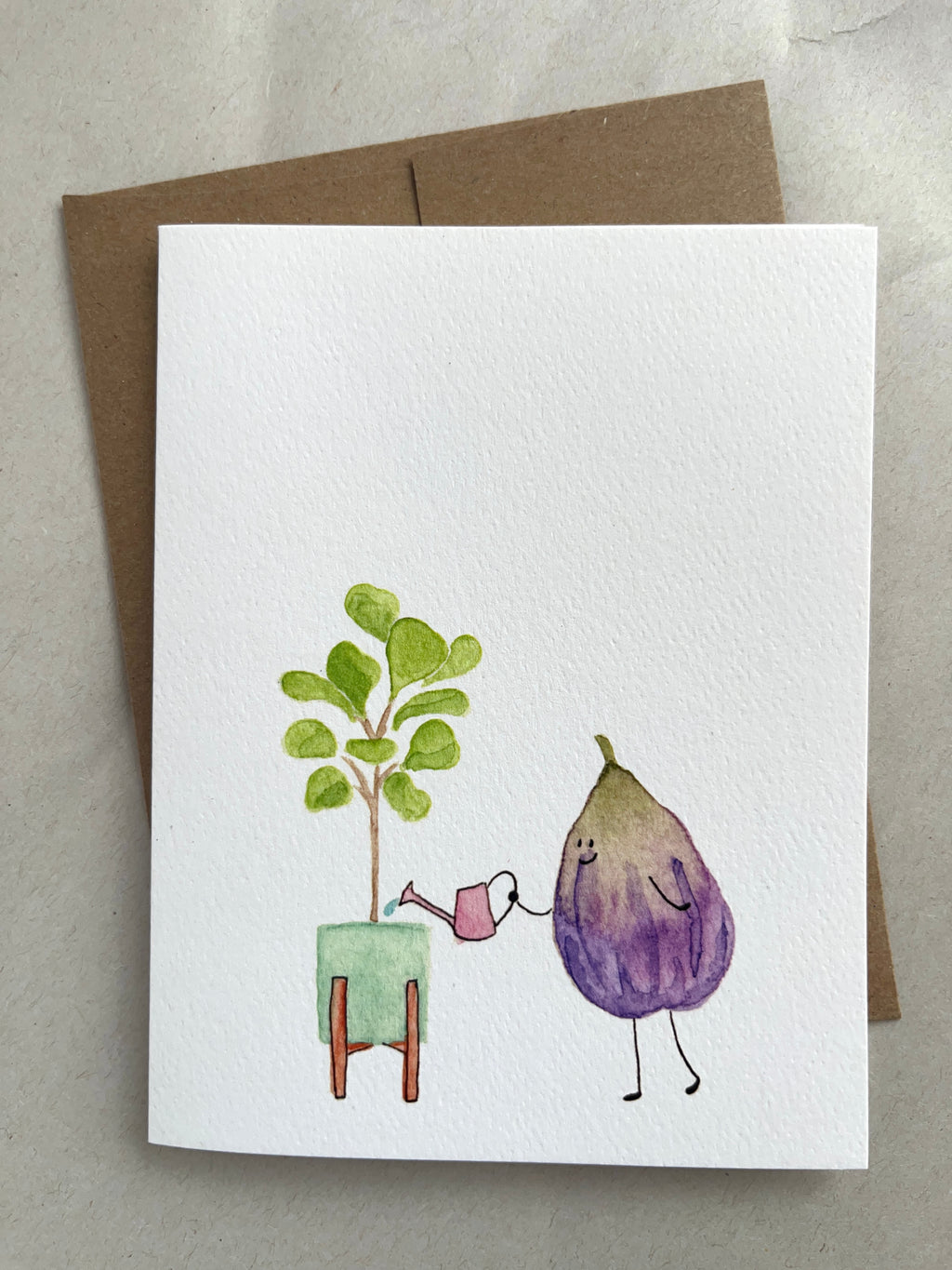 Greeting card with a fig character watering a  fiddle leaf plant on a beige backgroun