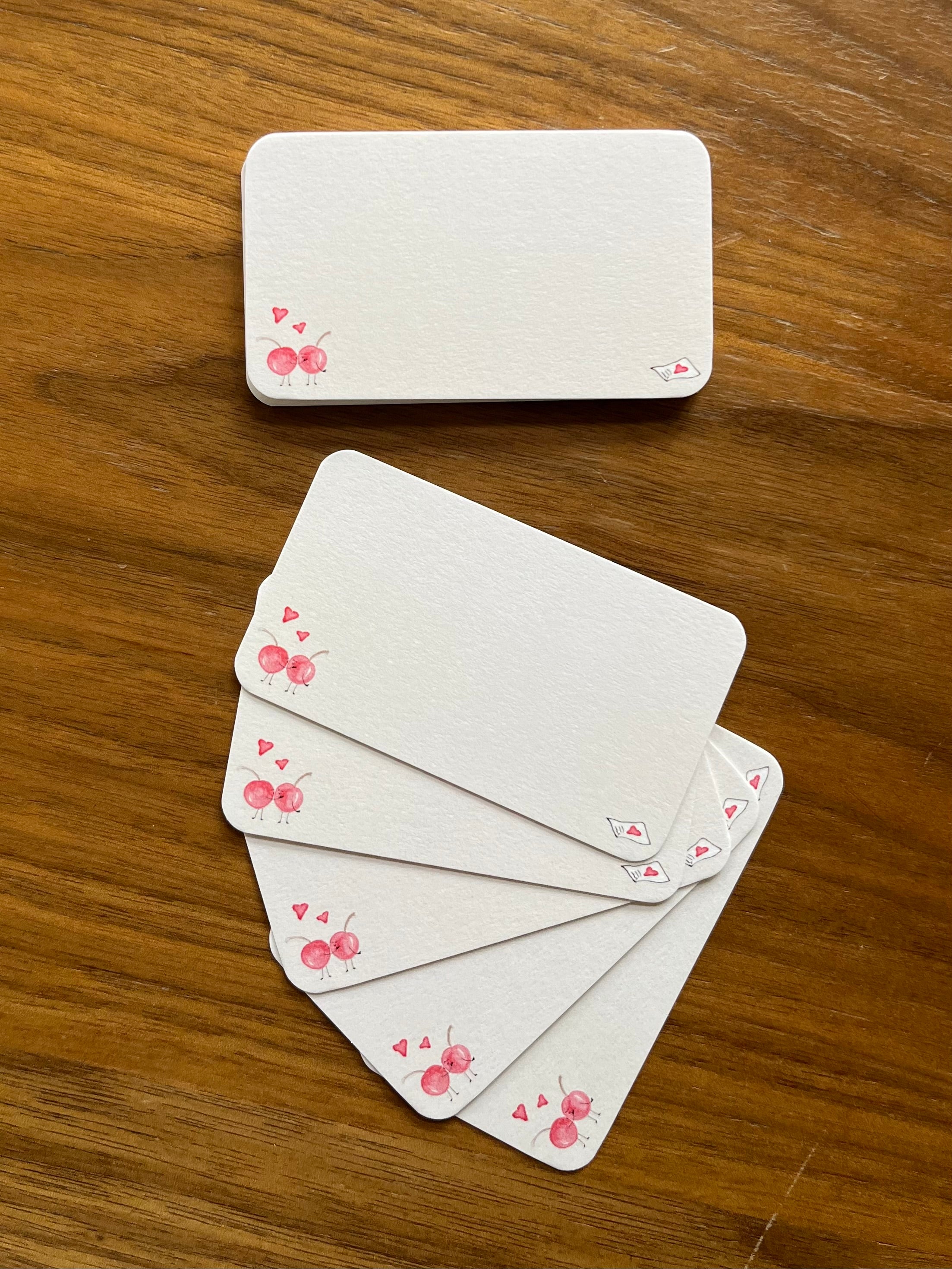 mei pie studio pink cherry love notes mini note set on classic crest neenah stock. close up on a wooden table