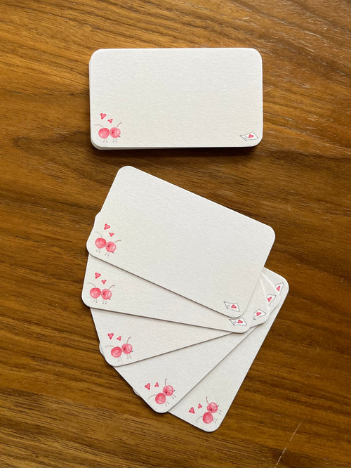 mei pie studio pink cherry love notes mini note set on classic crest neenah stock. close up on a wooden table